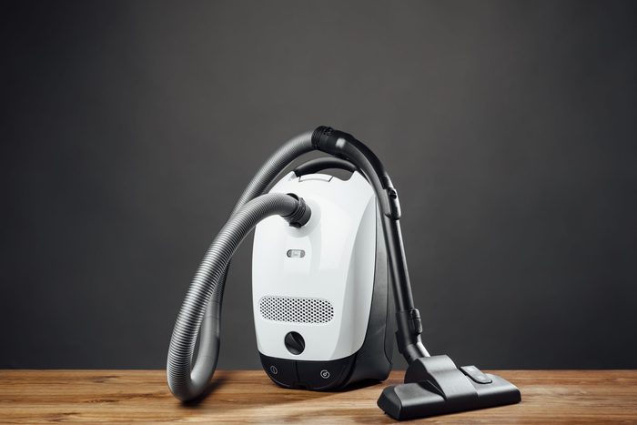 vacuum cleaner on grey background