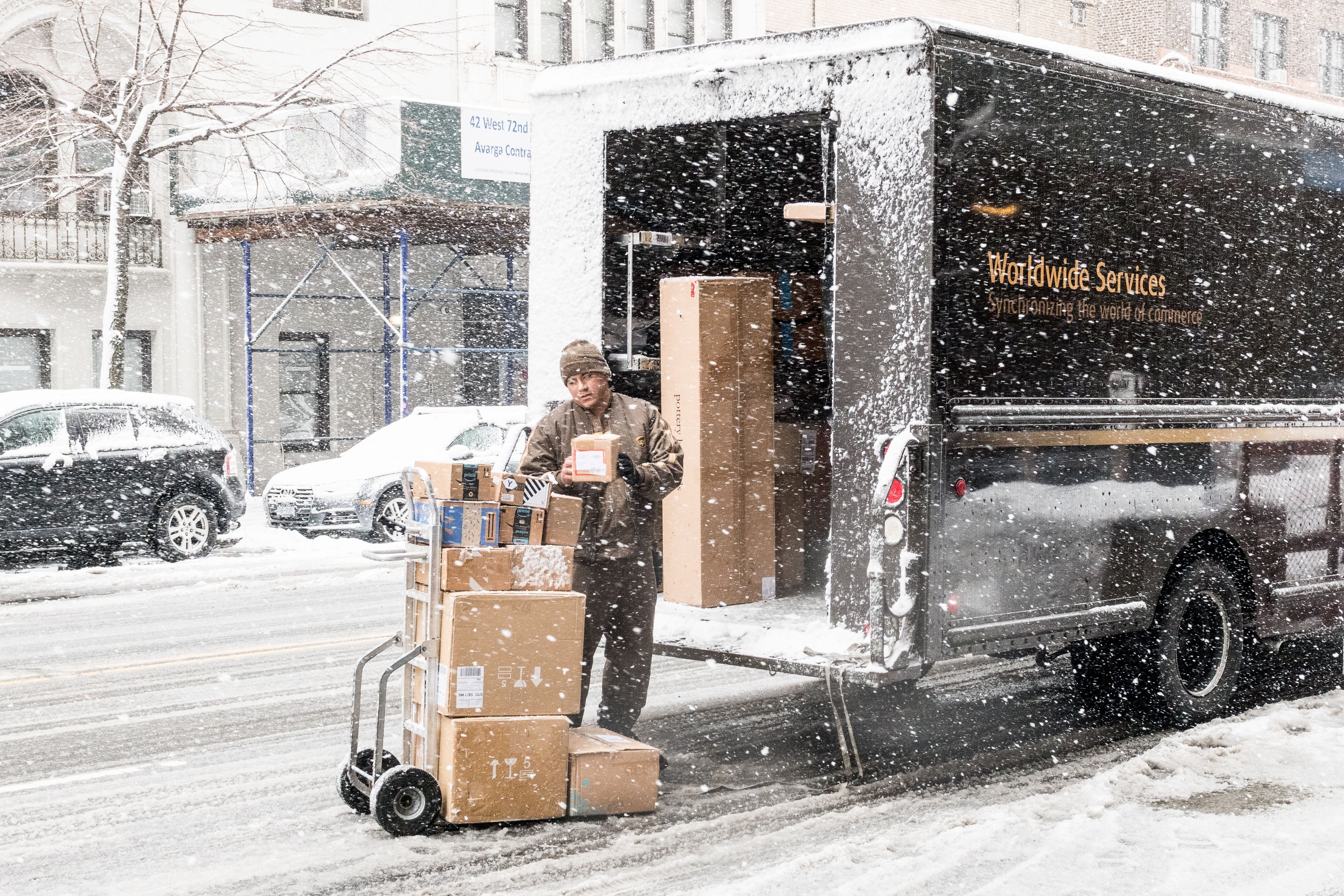 Mandatory Credit: Photo by Michael Brochstein/Sopa Images/Shutterstock (9472885d) Unloading a UPS (United Parcel Service) truck on West 72nd Street in a snow storm in New York City. Winter Storm Toby, New York, USA - 21 Mar 2018