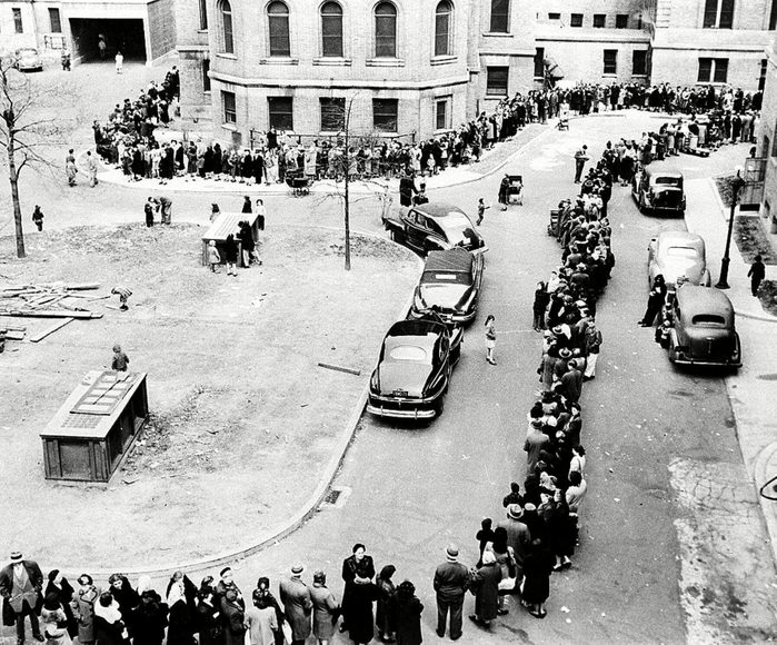 A long line of New Yorkers winds toward the entrance to Morrisania Hospital in the Bronx, New York April 14,1947, where doctors are innoculating against smallpox. They were attempting to half spread of the disease. Officials said city residents were being vaccinated at the rate of eight a minute