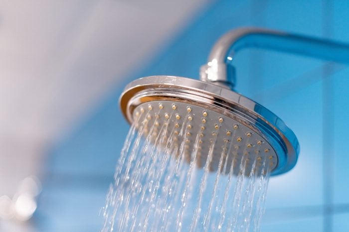 Shower head close up with water supply is turned on