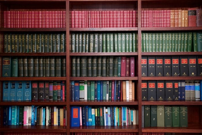 A bookshelf containing volumes of books