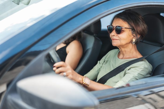 woman driving a car calmly