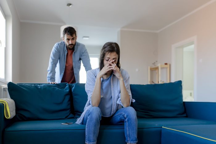 upset couple in their living room