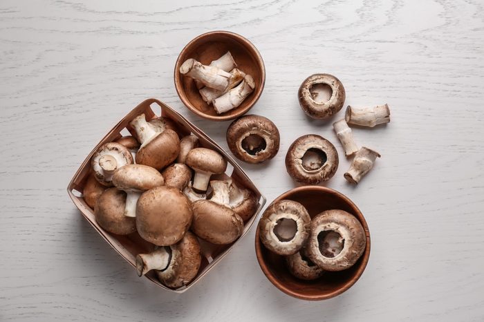 shiitake mushrooms on white wood background