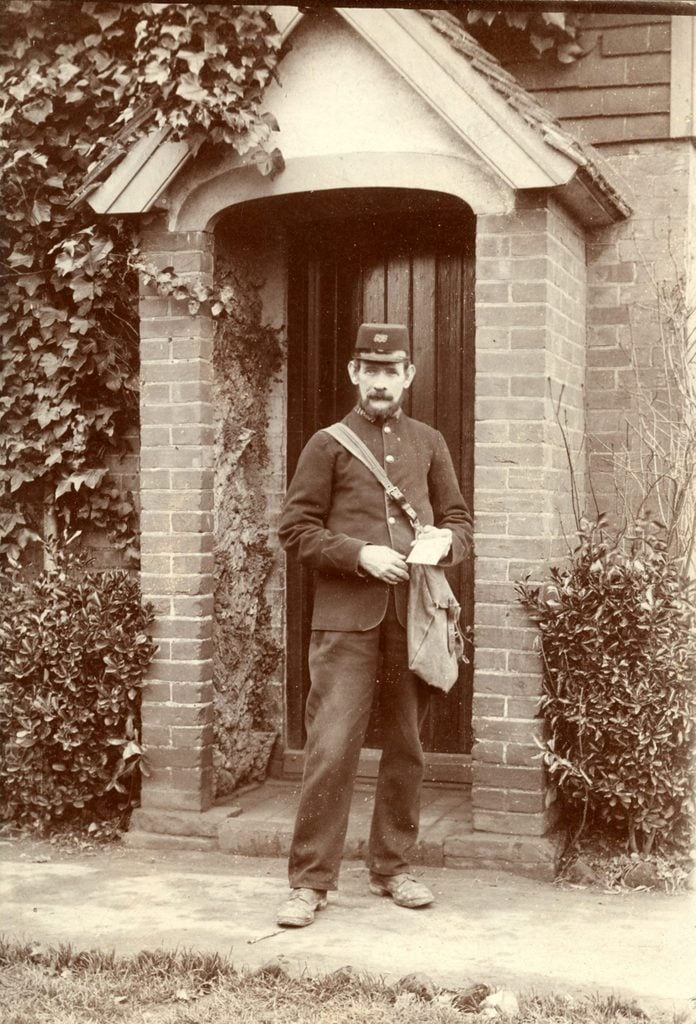 A postman, circa 1920.