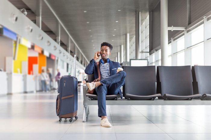 young man on the phone in a airport