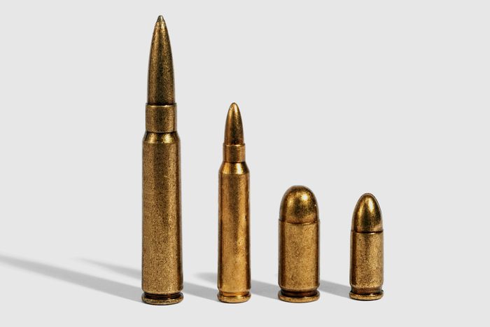 different sized bullets on a grey background