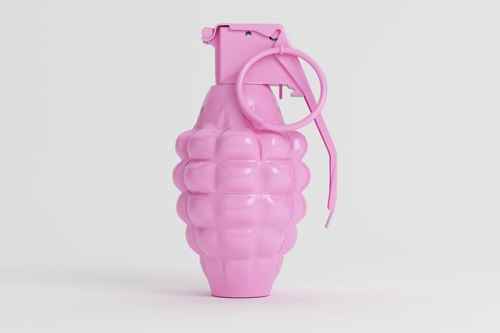 pink toy grenade on a grey background