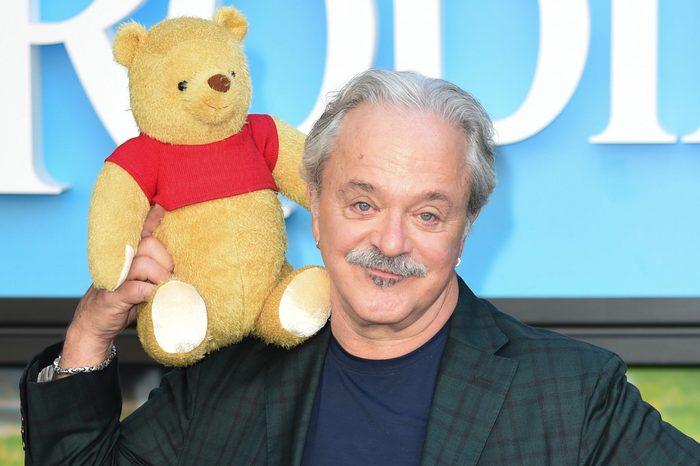 Jim Cummings holding a winnie the pooh stuffed animal at the london 'christopher robin' film premiere, 05 aug 2018