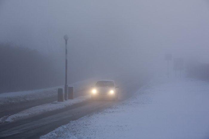 Winter driving in freezing fog on a country road in North Yorkshire in the United Kingdom.