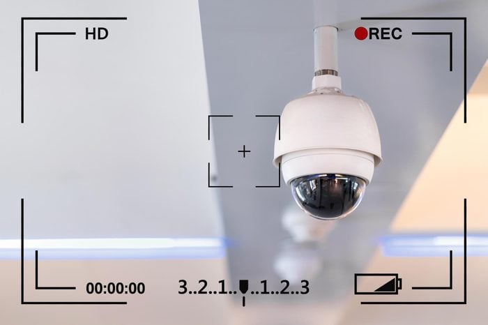 closed circuit camera hanging from ceiling with camera info overlay