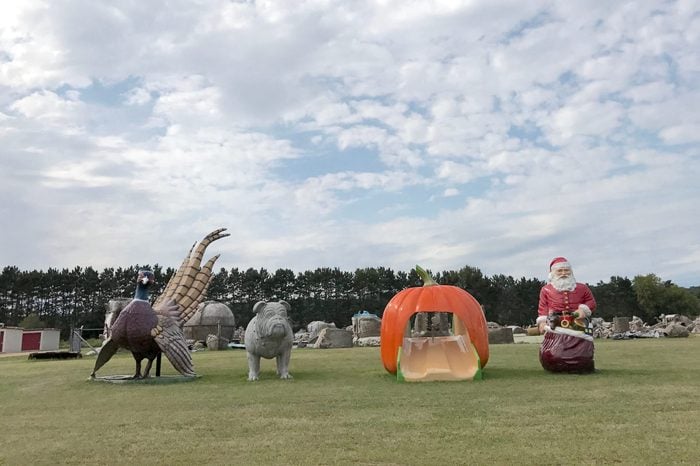 Sparta, Wisconsin / USA / August 25, 2017: 4 fiberglass bird, pig, pumpkin and santa on field owned by FAST (Fiberglass Animals, Shapes, and Trademarks)