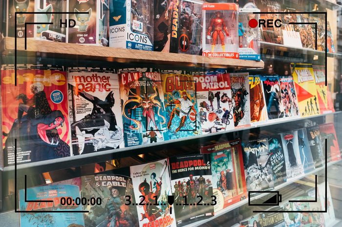 comic books on display with camera info overlay