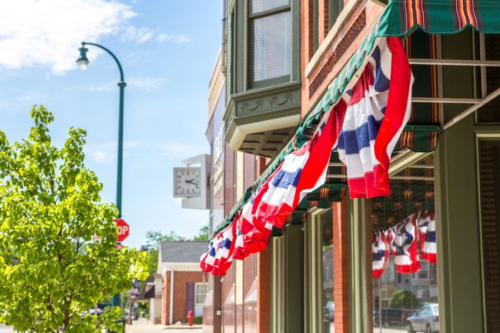 Patriotic bunting on a business in a small town, shallow depth 