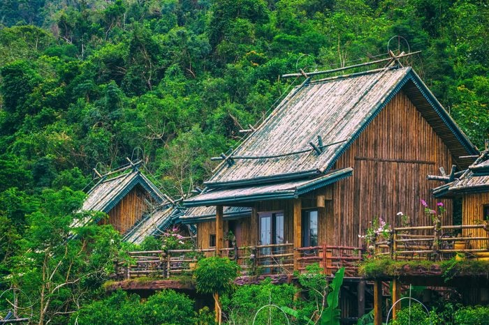Wooden bamboo house in the jungle. Sanya Li and Miao Village. Hainan, China.