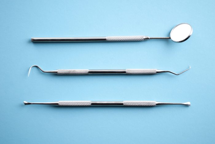 dentist utensils on a blue background