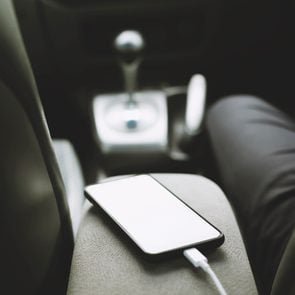 phone charging on the center console of a rental car