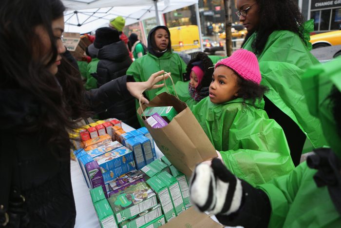 girl scout selling cookies