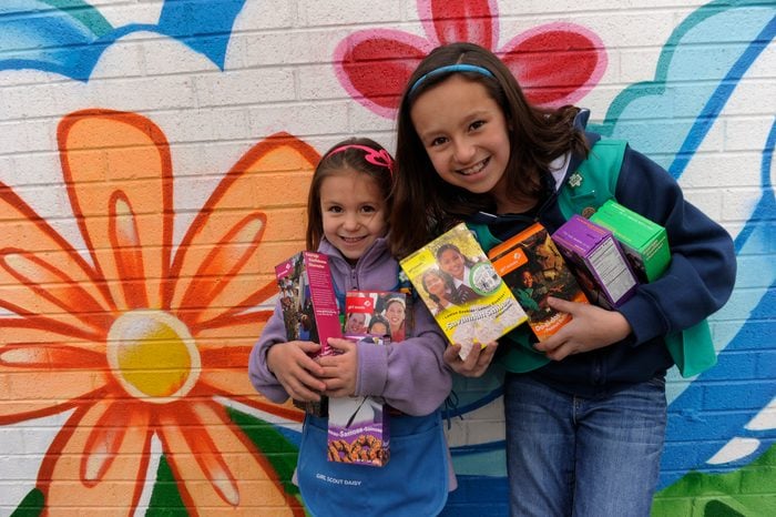 sisters sell girl scout cookies