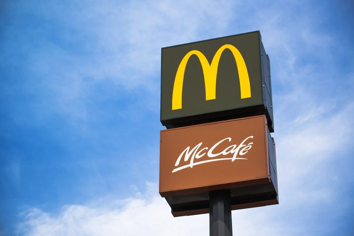 mcdonalds and mccafe signs against blue sky background