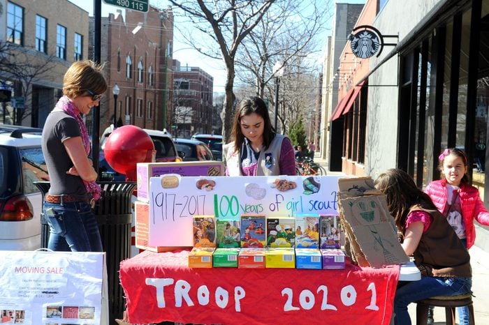 girl scout selling girl scout cookies