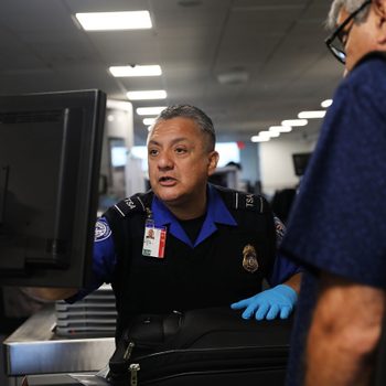 A Transportation Security Administration (TSA) worker screens luggage at LaGuardia Airport (LGA) on September 26, 2017 in New York City.