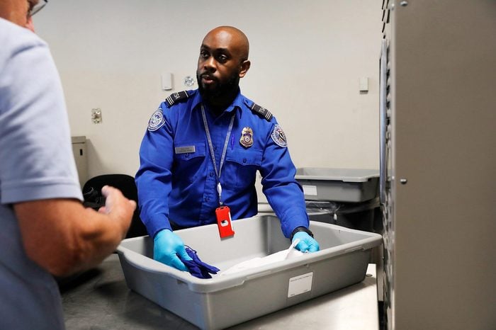 A Transportation Security Administration (TSA) worker screens luggage at LaGuardia Airport (LGA) on September 26, 2017 in New York City.
