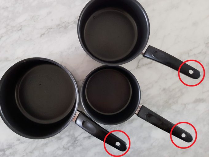 Three saucepans with handles