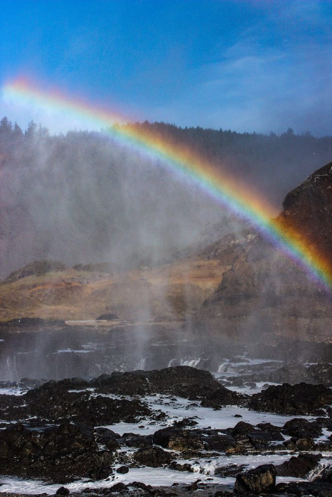 Devil's Punchbowl on the Oregon coast rainbow