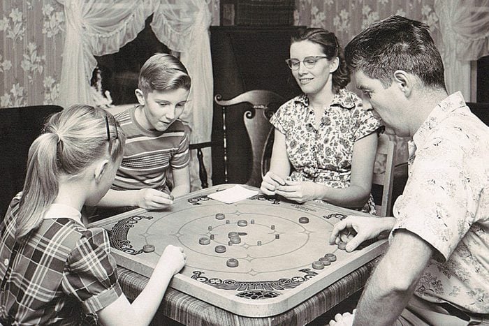 family playing board games vintage photo