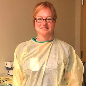 Ontario ER nurse Cynthia Rennie-Faubert stands in her scrubs