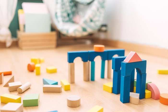colorful wooden building blocks in the floor at home or kindergarten, educational toys for creative children
