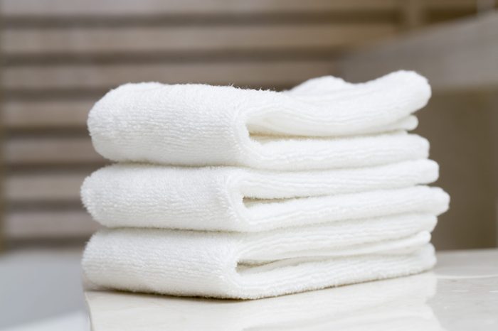 A stack of white spa towels folded