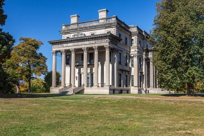Vanderbilt Mansion National Historic Site with Trees in Fall Colors (Foliage) and Vivid Blue Sky, Hyde Park, New York.