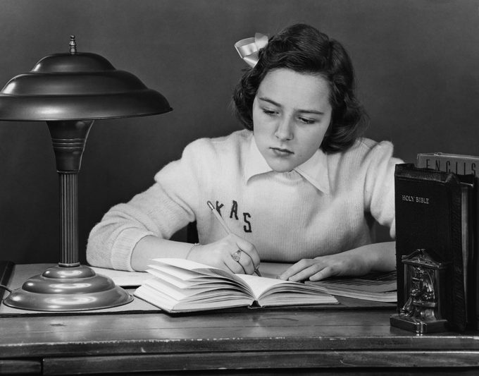 girl doing homework circa 1947