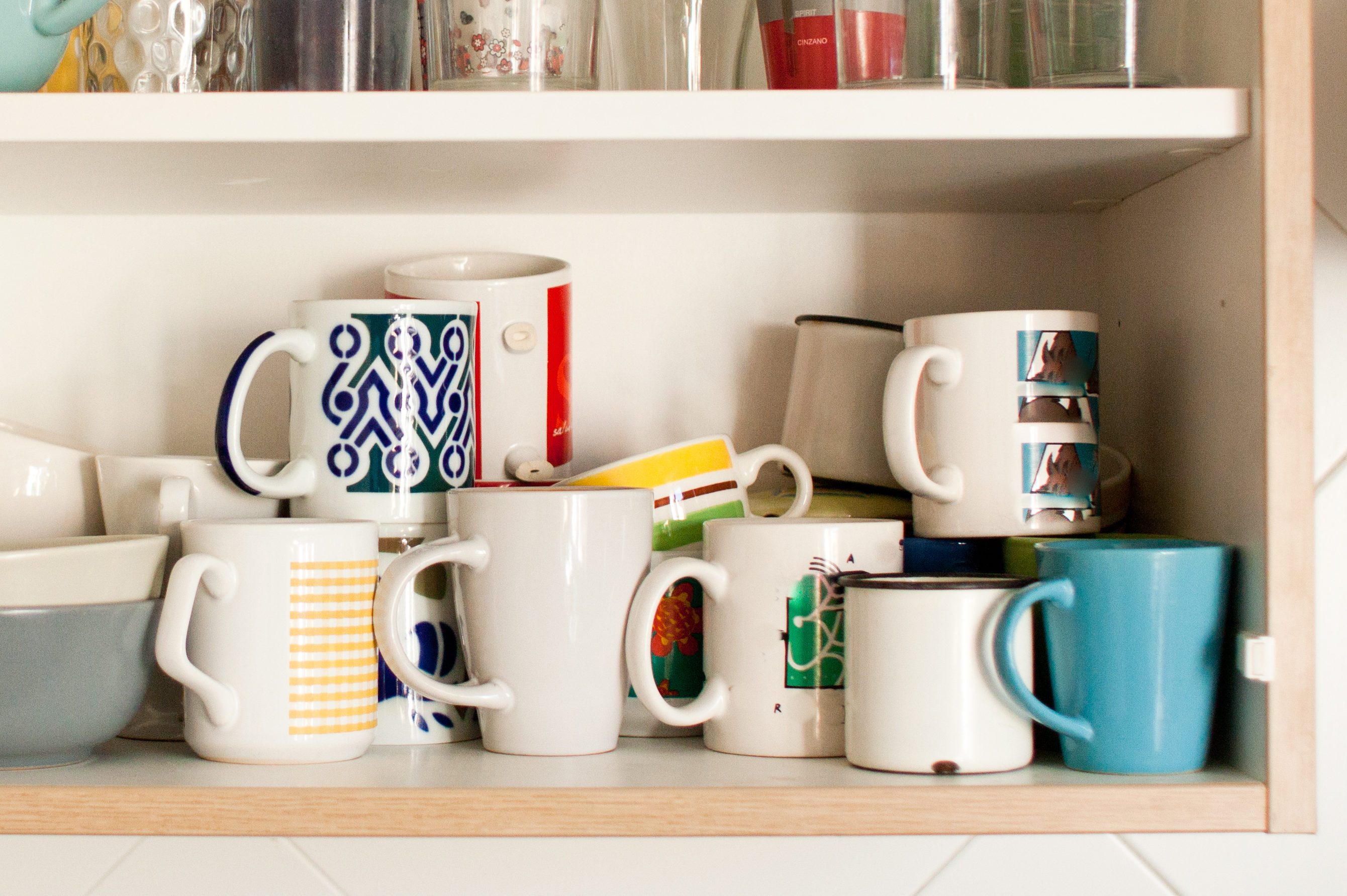 kitchen cabinet with mugs and glasses