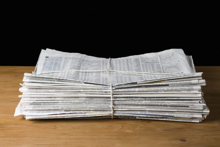A stack of newspapers tied up with string