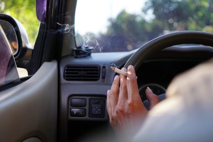 Smoking while driving a car