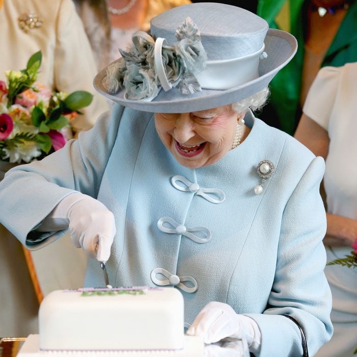 Queen Elizabeth cutting a cake