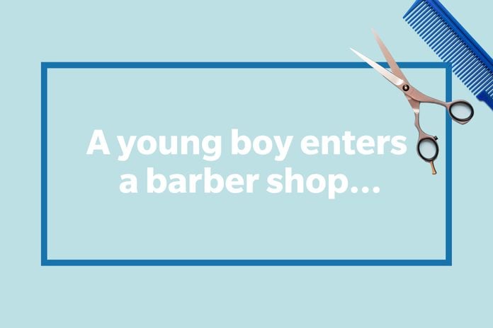 A young boy enters a barber shop...