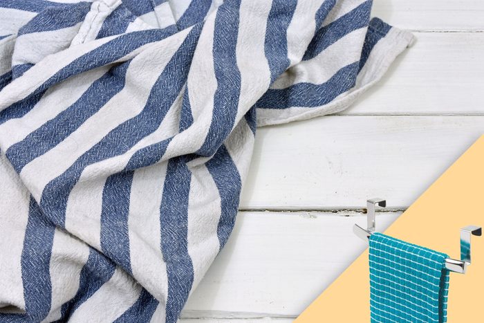 dish towel strewn on white wood background; with suggested product