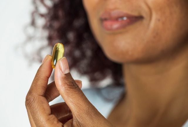 African Woman Showing Pill
