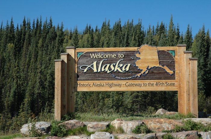 Welcome panel on the Alaska Highway at the Alaskan border