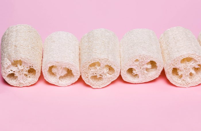 Loofah on a pink background. Organic natural sponge. Zero waste