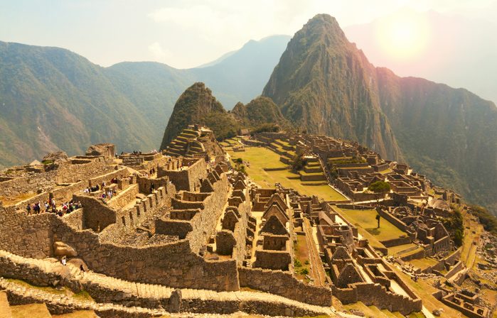 Machu Picchu, Cusco region, Peru: Overview of agriculture terraces, Wayna Picchu and surrounding mountains in the background, UNESCO, World Heritage Site. One of the New Seven Wonders of the World