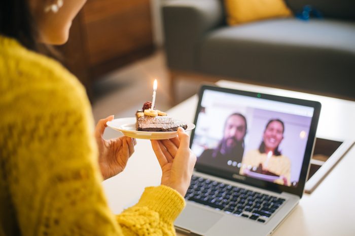 Woman celebrating birthday with video conference