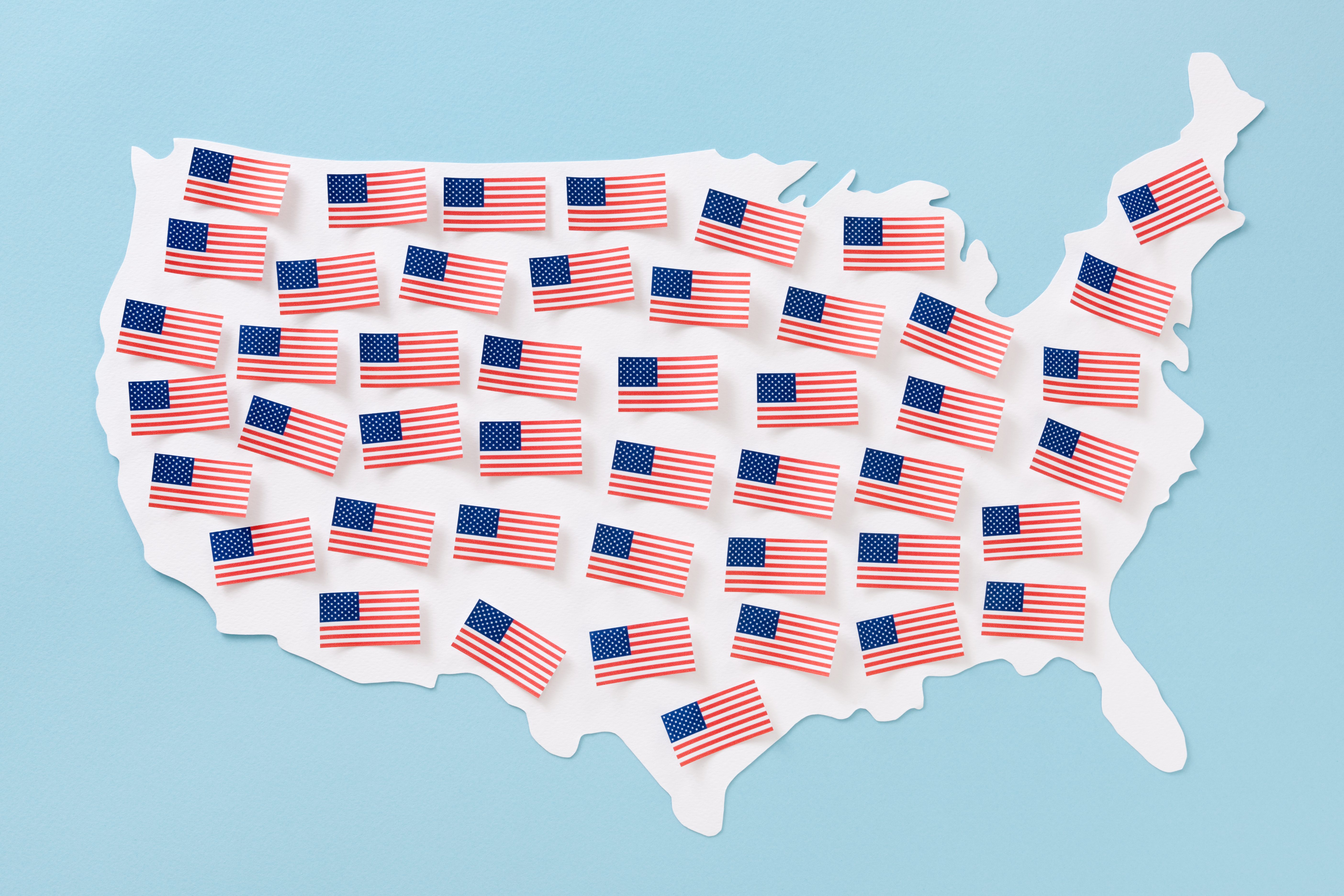 American flags over US map