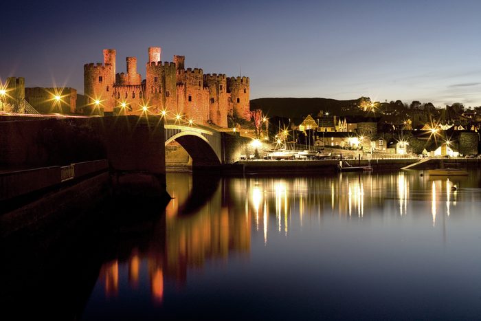 The View of the monumental Conwy Castle over the river Conwy at night, Wales, UK.