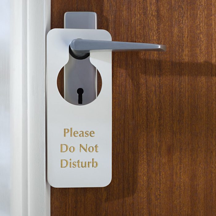 Do not disturb sign on a hotel room door