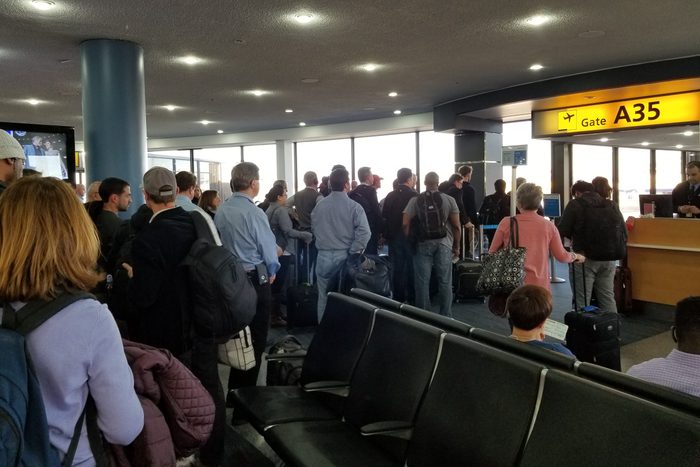 A long line of travelers waits to board a flight at Newark International Airport, Newark, New Jersey